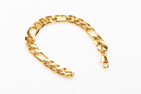 Gold bracelet isolated over whiteの写真素材