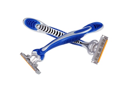 Two crossed shaving razors  