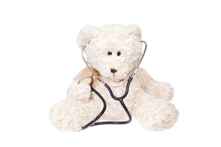 Teddy bear and stethoscope isolated on whiteの写真素材