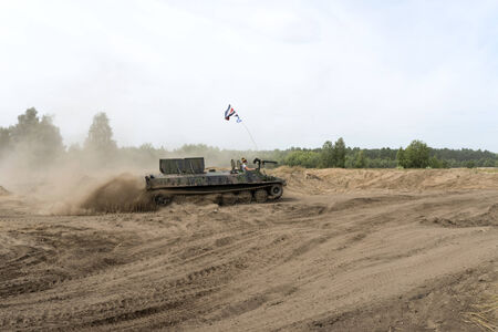 Driving on a military range during  X International meeting of military vehicles TRACKS AND...