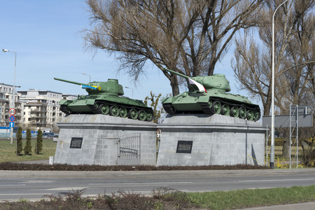 In solidarity with Ukraine have been placed Polish and Ukrainian flag on the memorial cemetery of Soviet soldiers from World War II in Wroclaw, Poland on March 20, 2014 のeditorial素材