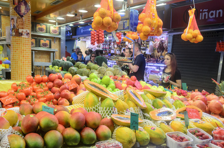 People are watching and buying in the Mercat de Sant Josep de la Boqueria in one of the oldest markets in Europe on 8 August 2014 in Barcelona, Spain..のeditorial素材