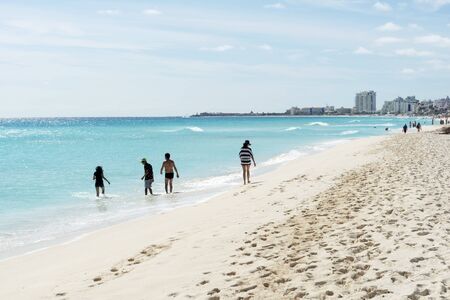 Tourists enjoy the sunny weather and relaxing on the beautiful beach on 18 January 2015 in Cancun, Mexico. This is one of the best beaches in the Mexico.のeditorial素材