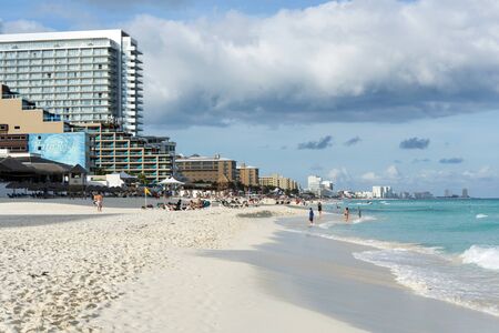 Tourists enjoy the sunny weather and relaxing on the beautiful beach on 18 January 2015 in Cancun, Mexico. This is one of the best beaches in the Mexico.のeditorial素材