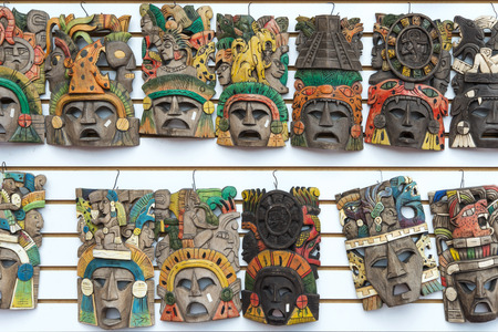 Mayan woodeMayan wooden handcrafted masks on the street market in Cacun, Mexico.n handcrafted masks on the street market in Cacun, Mexico.の写真素材