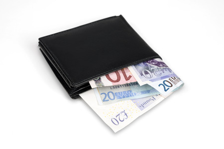 Wallet with euro and pound banknotes isolated over white with clipping path.
