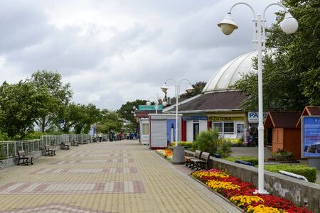 Tourists walking along the promenade by the sea on a cold summer day on 10 July 2015 in Ustka, Poland.のeditorial素材