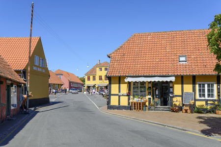 View of a street with the typical old colored houses on 14 August 2015 in Svaneke on Bornholm Island, Denmark.のeditorial素材