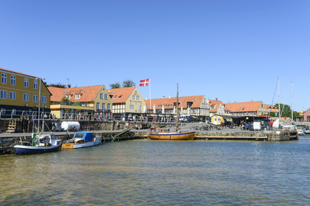 Tourists enjoy the sunny weather and walking along the quay at the port on 14 August 2015 in Svaneke on Bornholm Island, Denmark.のeditorial素材