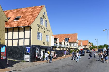 Tourists enjoy the sunny weather and walking through the old town on 14 August 2015 in Svaneke on Bornholm Island, Denmark.のeditorial素材