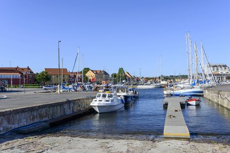View of the marina full of sailing boats and fishing boats in summer sunny day on 14 August 2015 in Nexo on Bornholm Island, Denmark.のeditorial素材