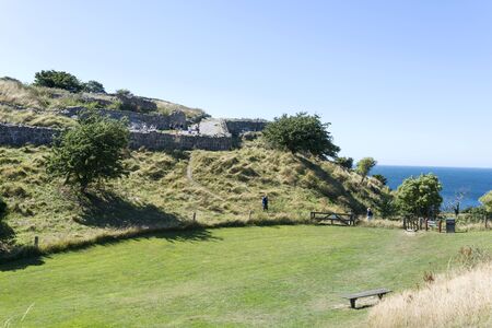 Tourists enjoy the sunny weather and visit the ruins of the Hammershus castle ruins on 14 August 2015 on Bornholm Island, Denmark.のeditorial素材