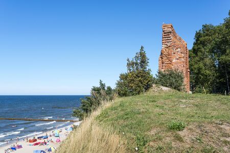 Ruins of gothic church from 1415th century located in Trzesacz near the Baltic Sea. Currently, Remained only fragment of southern wall. Trzesacz village, Poland, Europe.の写真素材