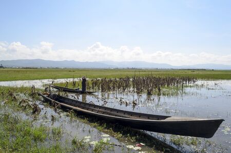 Old long motor boat on the Inle lake, Shan State, Myanmar BURMA. This is a traditional transport in this area.の写真素材