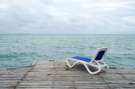 Empty beach chair on the dock in Cayo Guillermo - Ciego de Avila Province, Cuba.の写真素材