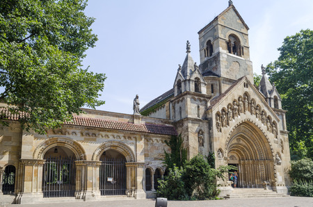 Tourists enjoying the beautiful weather visit Chapel in castle Vajdahunjad on August 9, 2015 in Budapest, Hungary. Vajdahunyad Castle is located in the City Park.のeditorial素材