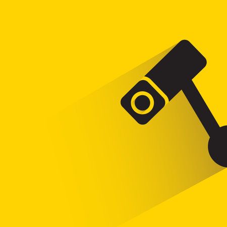 CCTV with shadow on yellow backgroundのイラスト素材