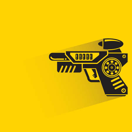 space gun with shadow on yellow backgroundのイラスト素材