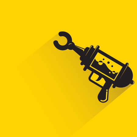space gun with shadow on yellow backgroundのイラスト素材