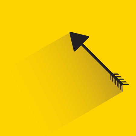 arrow with shadow on yellow background