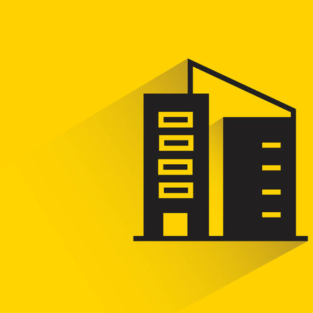 building icon with shadow on yellow background. flat design. vector illustrationのイラスト素材