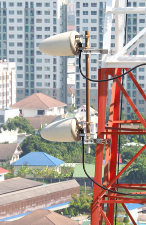 Telecommunication tower closeup with red and white color.の写真素材