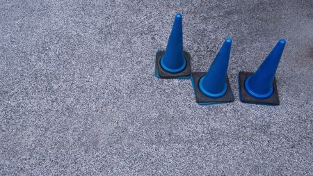 Blue traffic cones and cement floor.の写真素材