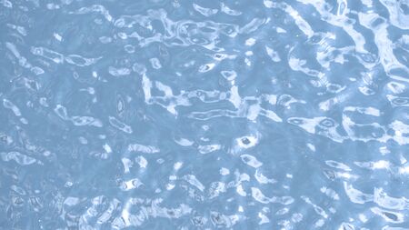 Blue water waving and top view of river and dirty river and reflex of sun.の写真素材