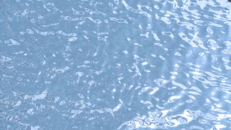 Blue water waving and top view of river and dirty river and reflex of sun.の写真素材