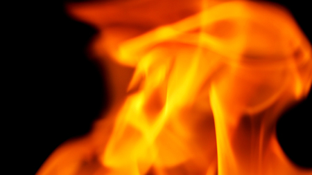 Fire close-up for use as abstract background that represent of hot burn danger.の写真素材