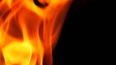 Abstract flame yellow and red and orange color on black background for represent hot or dangerous...