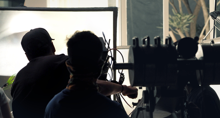 Making of TV commercial production in studio with professional equipment such as camera light tripod crane and crew team.の写真素材