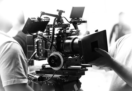 Movie shooting or video filming production by crew team and professional equipment such as super...