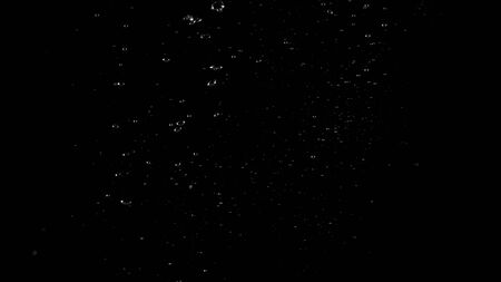 Water bubbles floating after splash underwater and black background which represent freshness of carbonate drink such as cola or soda and refreshing feeling of food product and texture.の写真素材