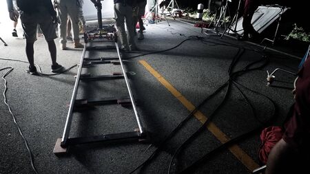 Video production camera dolly track at outdoor location setting for shooting movie or film that need...