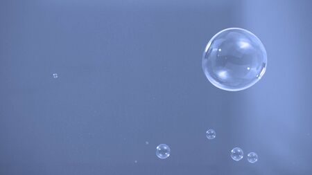 Soap or shampoo bubbles floating in the air by wind blow which represent refreshing and relaxing or joyful mood and tone and shoot in clear background in studio lighting set.の写真素材