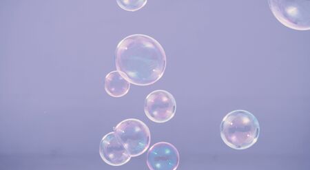 Shampoo bubbles floating like flying in the air by wind blow which represent refreshing playful or...