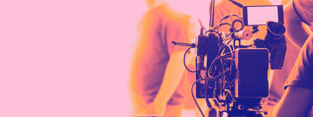 Behind the scenes of video recording or filming online movie by 8K high definition digital camera and professional monitor. And flare lighting set up with film crew team in the studio production.の写真素材