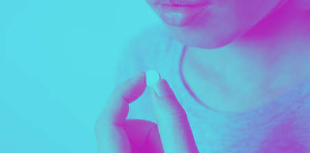 Close-up images of people taking or holding a medicine pill in hand which help and protect from...
