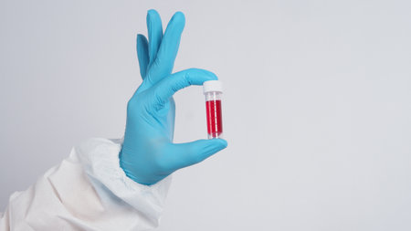 Blood tube. Covid 19 Test. doctor hand holding a blood sample tube for analysis in the lab...