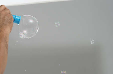 Shampoo bubbles floating like flying in the air by wind blow which represent refreshing playful...
