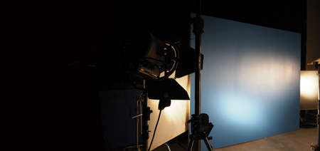 Studio light equipments for photo or film movie video. Light set for professional shooting and screen background. LED Flood light and Spot light for video production. Setup include Barn door softbox.の写真素材