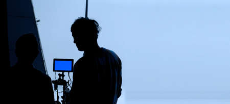 Video production behind the scenes. Making of TV commercial movie that film crew team lightman and...