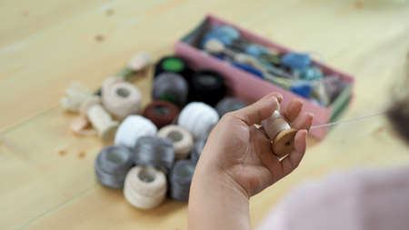 Woman hands and craft work. Embroider sewing by hand. Handicraft work by thread needle sew knit....