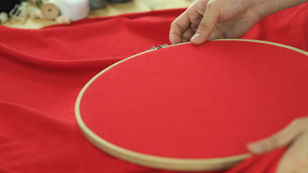 Woman hands and craft work. Embroider sewing by hand. Handicraft work by thread needle sew knit....