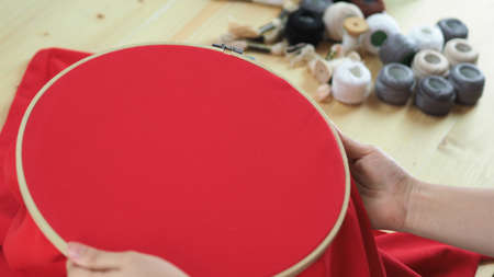 Woman hands and craft work. Embroider sewing by hand. Handicraft work by thread needle sew knit....