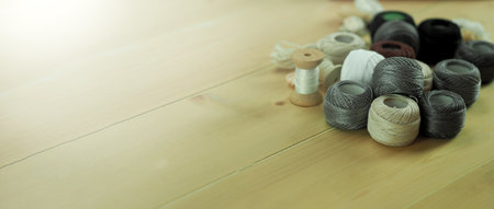 Embroider sewing by woman hand. Craft work and female hands. Handicraft work by thread needle sew knit. Wood frame embroidery hoop. Needlework handicraft crafting quarantine leisure concept.の写真素材