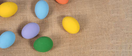 Easter eggs or color egg. Multi-colorful of easter eggs on background in studio with close-up shot which include many colour such as yellow, green, blue, purple, red on festival eggs by art painting.の写真素材
