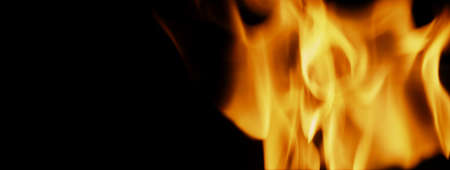 Fire background. Abstract burning flame and black background. represents the power of burning refers...