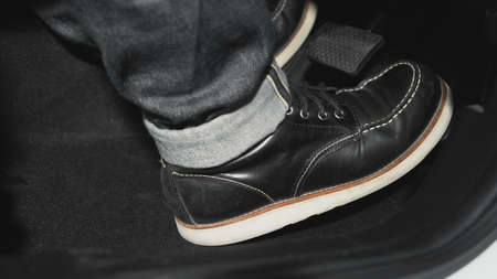 Accelerator and breaking pedal in a car. Close up the foot pressing foot pedal of a car to drive...